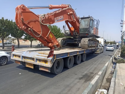 حمل محمولات سنگین بیل مکانیکی هیتاچی از مبدا تهران به مقصد جاجرم توسط کمرشکن 7 محور شرکت خلیج فارس ترابر_