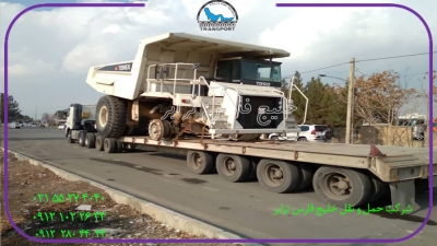 حمل محمولات سنگین دامپتراکDump truck TerexXاز مبدا تهران به مقصد لردگان توسط کمرشکن 9محور شرکت حمل ونقل خلیج فارس ترابر